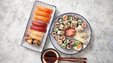 亚洲各种食物。 摆放在陶瓷盘子里的各种寿司卷